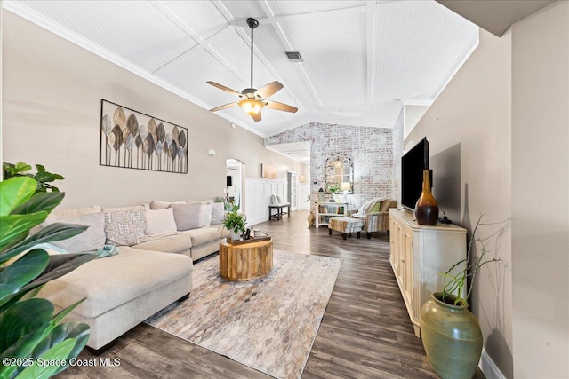 living room with ceiling fan, lofted ceiling, ornamental molding, and dark hardwood / wood-style flooring