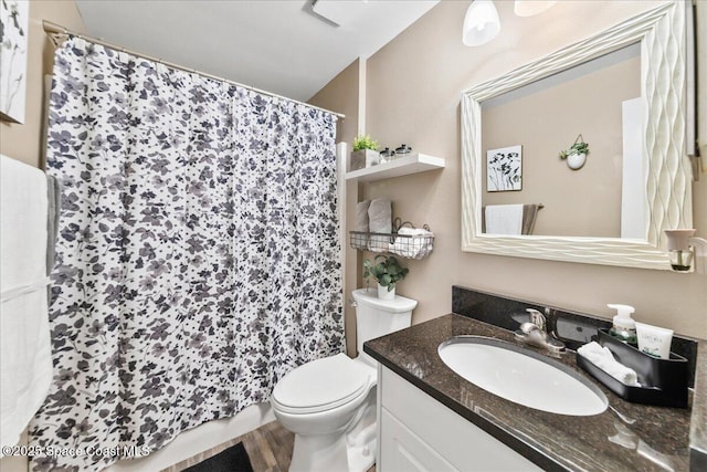 bathroom featuring vanity and toilet