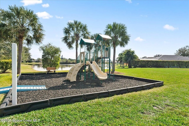 view of playground featuring a water view and a yard