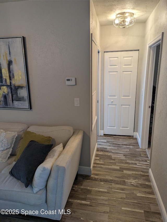 hall with dark hardwood / wood-style floors