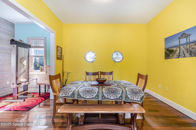 dining room with wood-type flooring