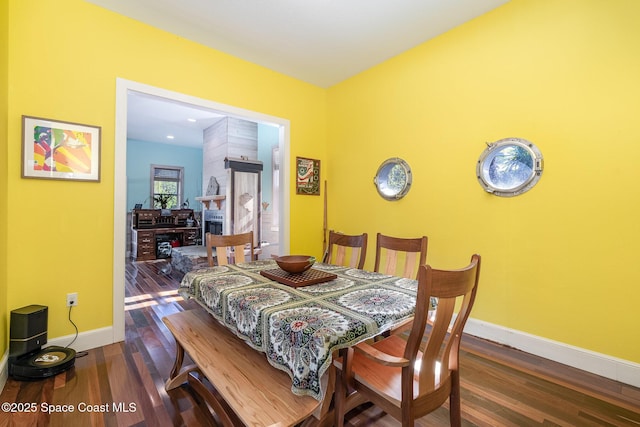 dining room with dark hardwood / wood-style flooring