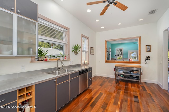 interior space featuring ceiling fan, stainless steel dishwasher, dark hardwood / wood-style flooring, and sink