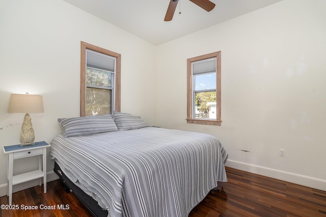 bedroom featuring ceiling fan and dark hardwood / wood-style floors