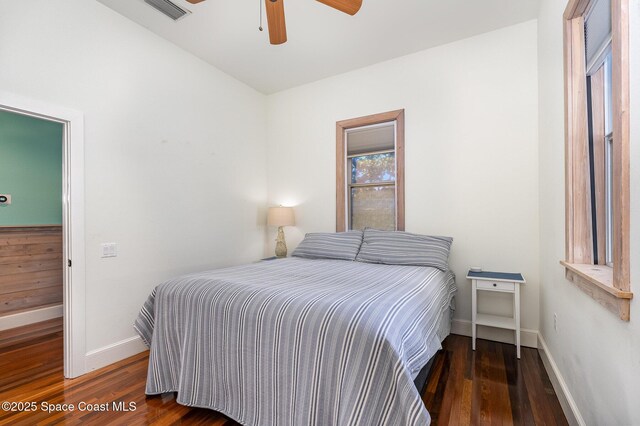 bedroom featuring dark wood-type flooring and ceiling fan