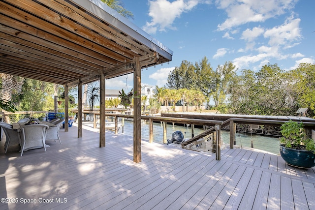 wooden terrace with a water view