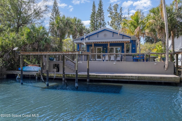 back of house featuring a water view