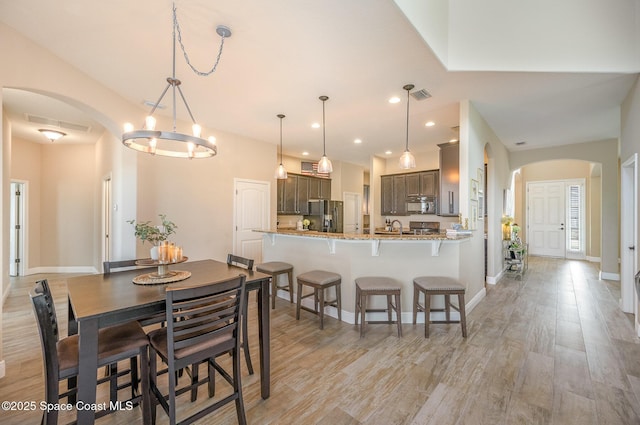 dining space featuring light wood-type flooring