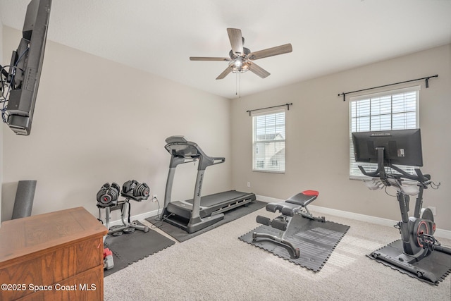 workout area featuring ceiling fan and carpet floors