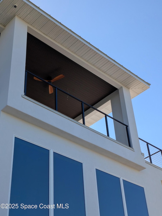 2050 S Atlantic Ave, Cocoa Beach, FL 32931 - exterior view of stucco siding and ceiling fan