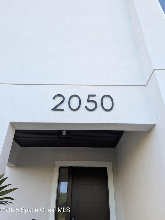 2050 S Atlantic Ave, Cocoa Beach, FL 32931 - exterior view of stucco siding