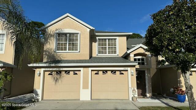 view of front of property featuring a garage