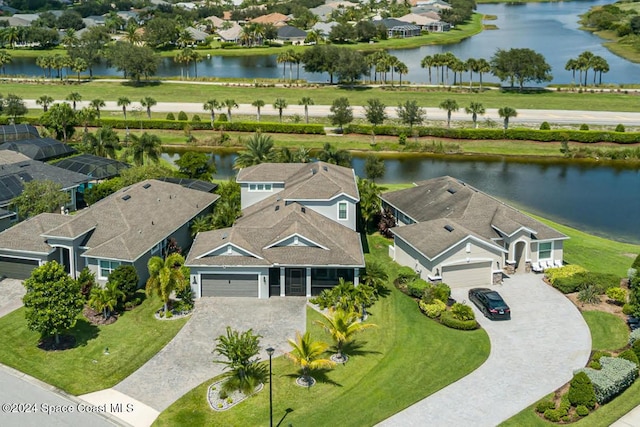 birds eye view of property featuring a water view