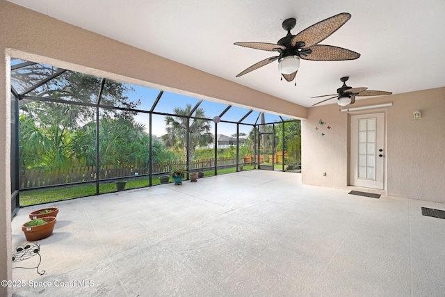 view of patio / terrace featuring a lanai and ceiling fan