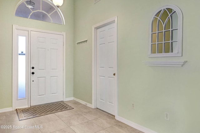 entrance foyer with light tile patterned flooring