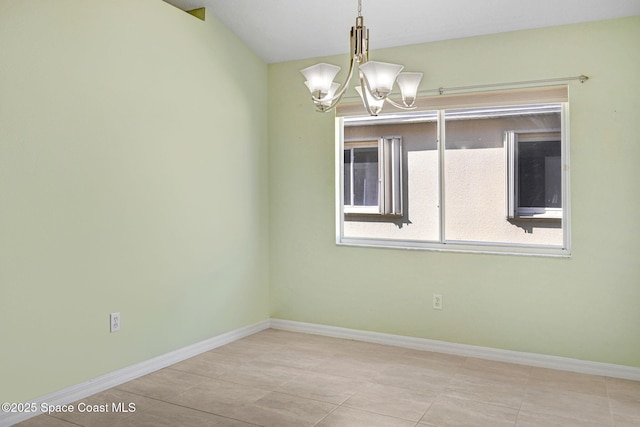 empty room featuring an inviting chandelier