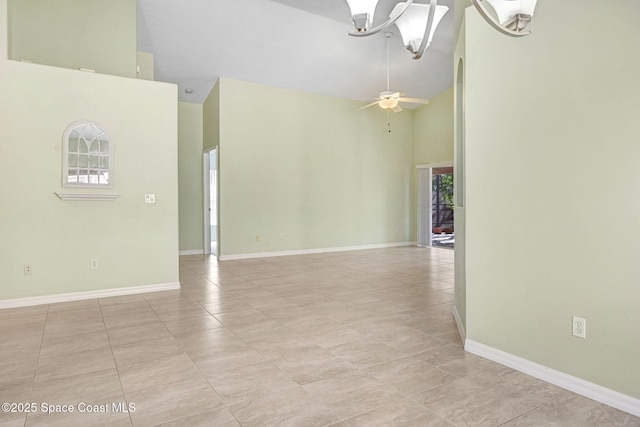 spare room with plenty of natural light, high vaulted ceiling, and ceiling fan