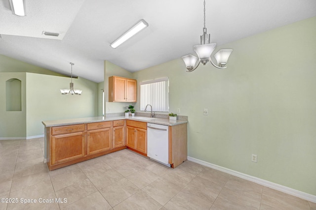 kitchen featuring sink, an inviting chandelier, white dishwasher, decorative light fixtures, and kitchen peninsula