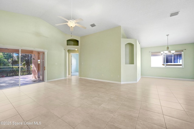 spare room featuring high vaulted ceiling, ceiling fan with notable chandelier, and light tile patterned floors