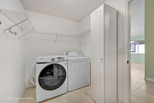 clothes washing area with washer and dryer