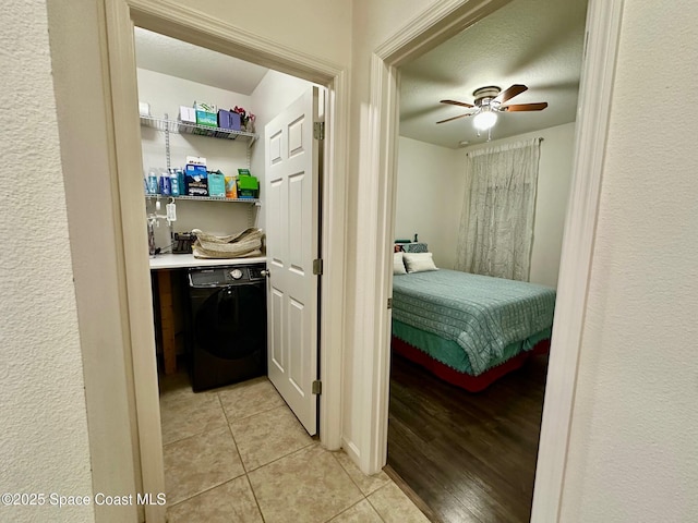 tiled bedroom with ceiling fan