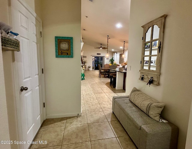 hallway featuring light tile patterned flooring