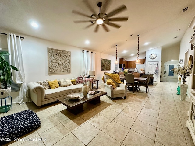 tiled living room featuring vaulted ceiling and ceiling fan