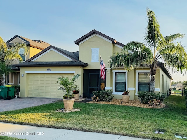 view of front of home featuring a garage and a front yard