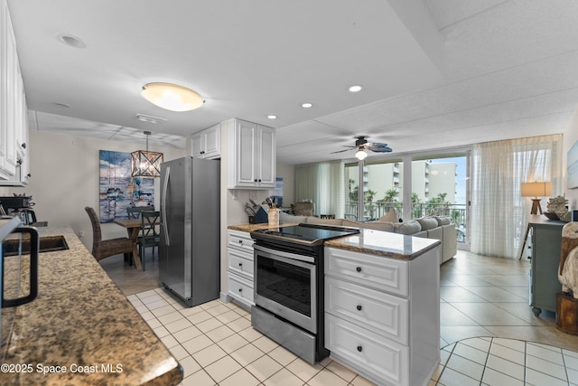 kitchen featuring white cabinetry, sink, dark stone countertops, ceiling fan, and stainless steel appliances