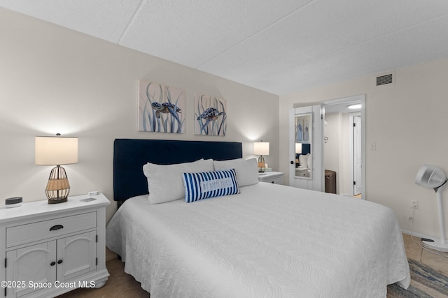 bedroom featuring a textured ceiling