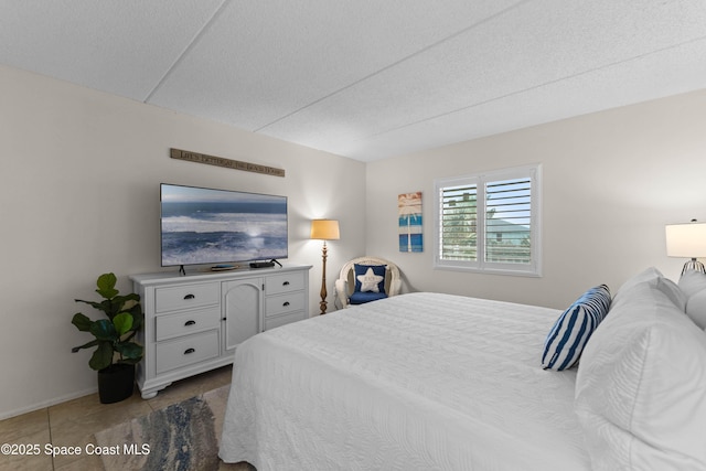 tiled bedroom with a textured ceiling