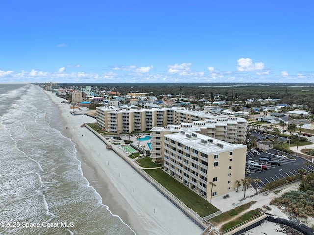 aerial view featuring a water view and a beach view