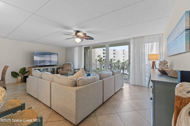 tiled living room featuring ceiling fan