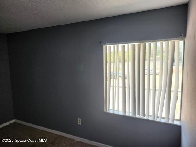 unfurnished room featuring carpet floors