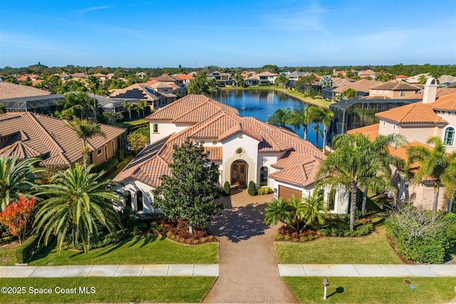 birds eye view of property featuring a water view