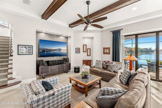 living room featuring ceiling fan and beam ceiling