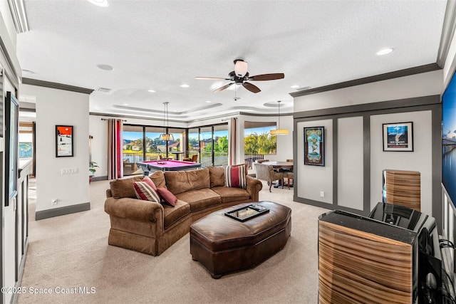 living room with crown molding, billiards, ceiling fan, a textured ceiling, and light carpet