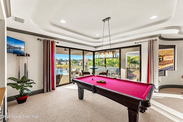 playroom featuring a water view, billiards, carpet flooring, and a raised ceiling