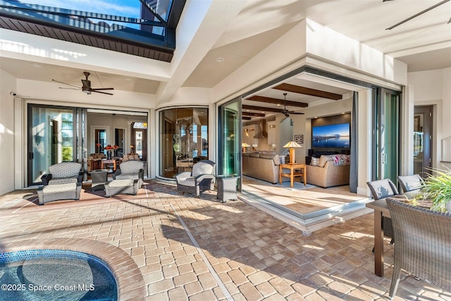 view of patio featuring ceiling fan