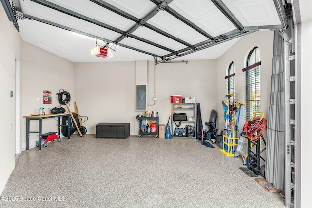 garage with a garage door opener and electric panel