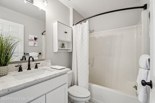 full bathroom featuring vanity, shower / tub combo, and toilet