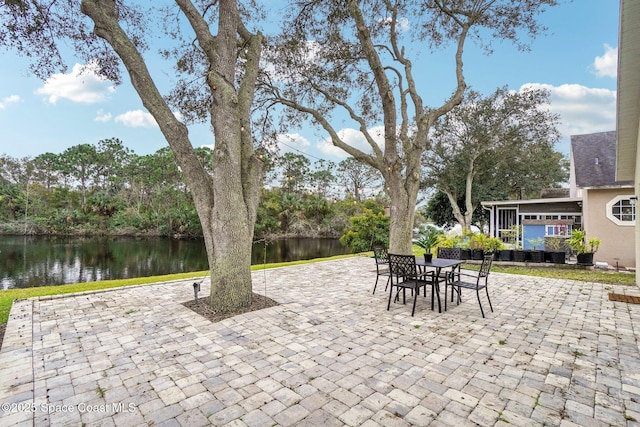 view of patio with a water view