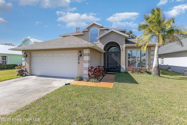 view of front of property with a garage and a front yard