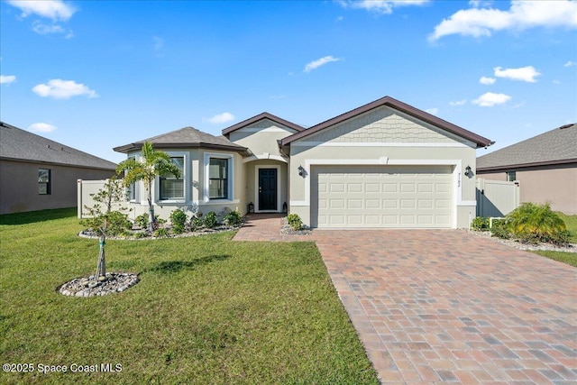 ranch-style house with a garage and a front lawn