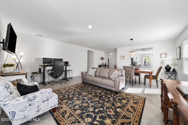 living room with light tile patterned flooring