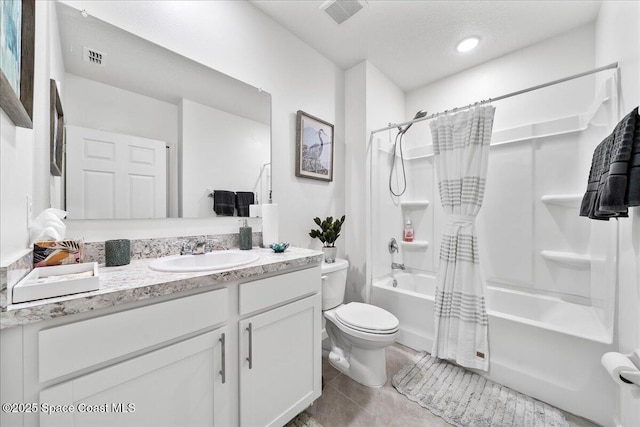 full bathroom featuring vanity, toilet, tile patterned flooring, and shower / tub combo