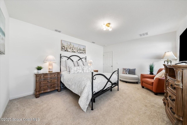 bedroom featuring light carpet