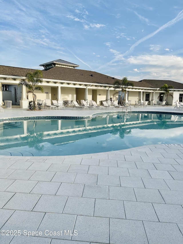 view of swimming pool with a patio area