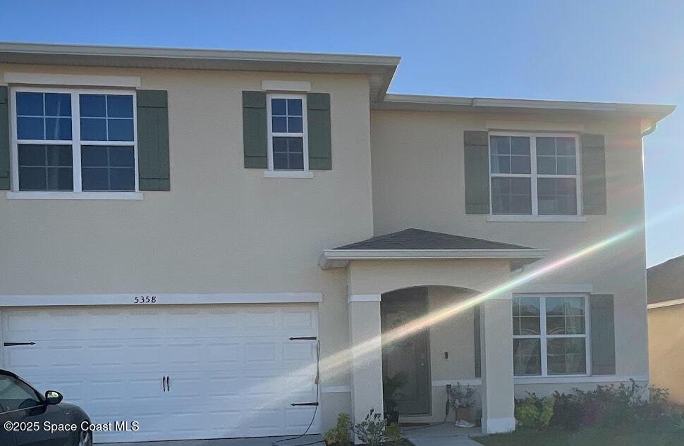 view of front of home featuring a garage