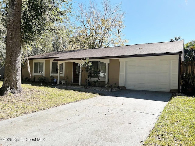 ranch-style house with a garage and a front yard